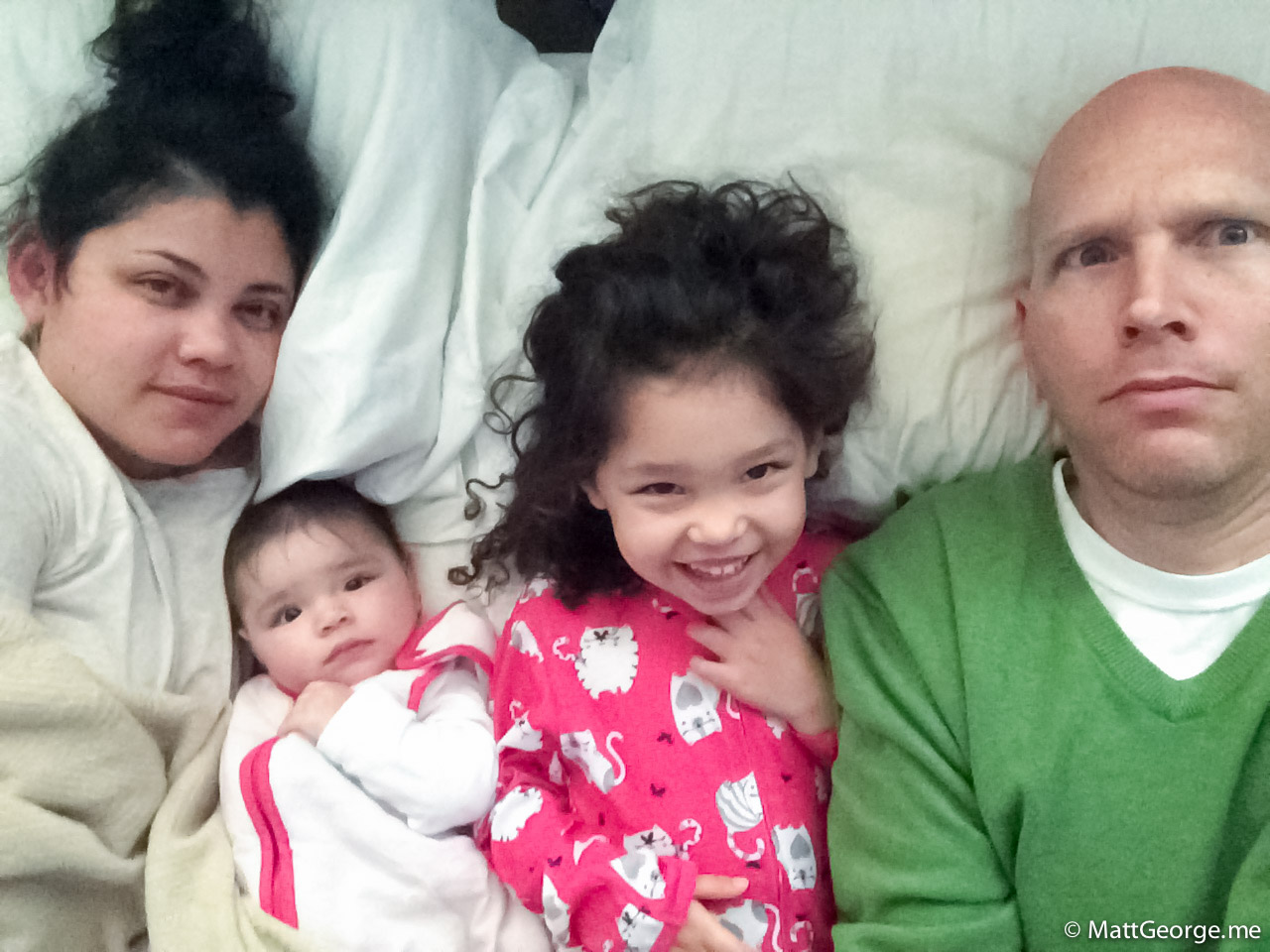 Mom, Baby Gianna, Bella, and Daddy on the Bed