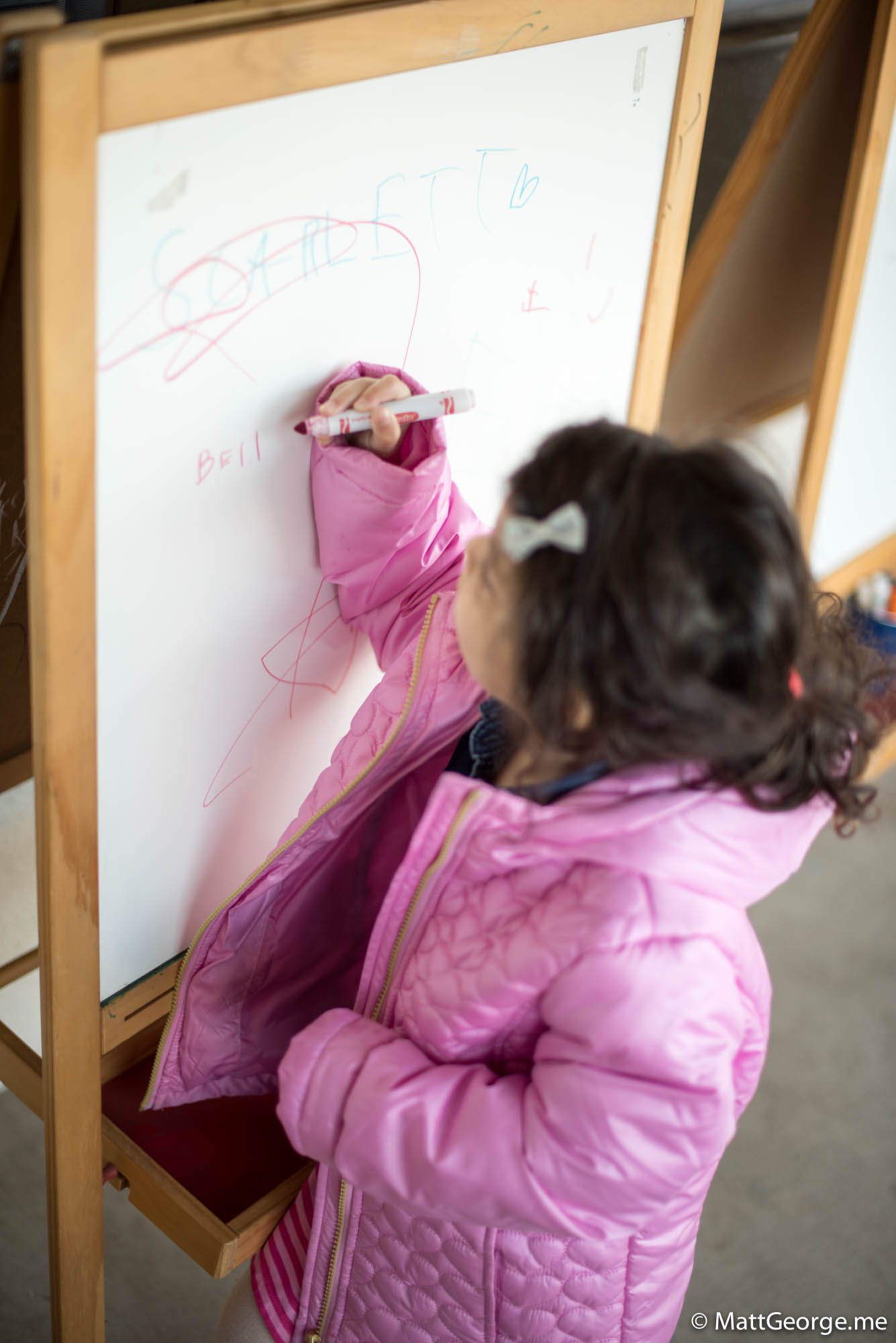 Bella writing her name for class