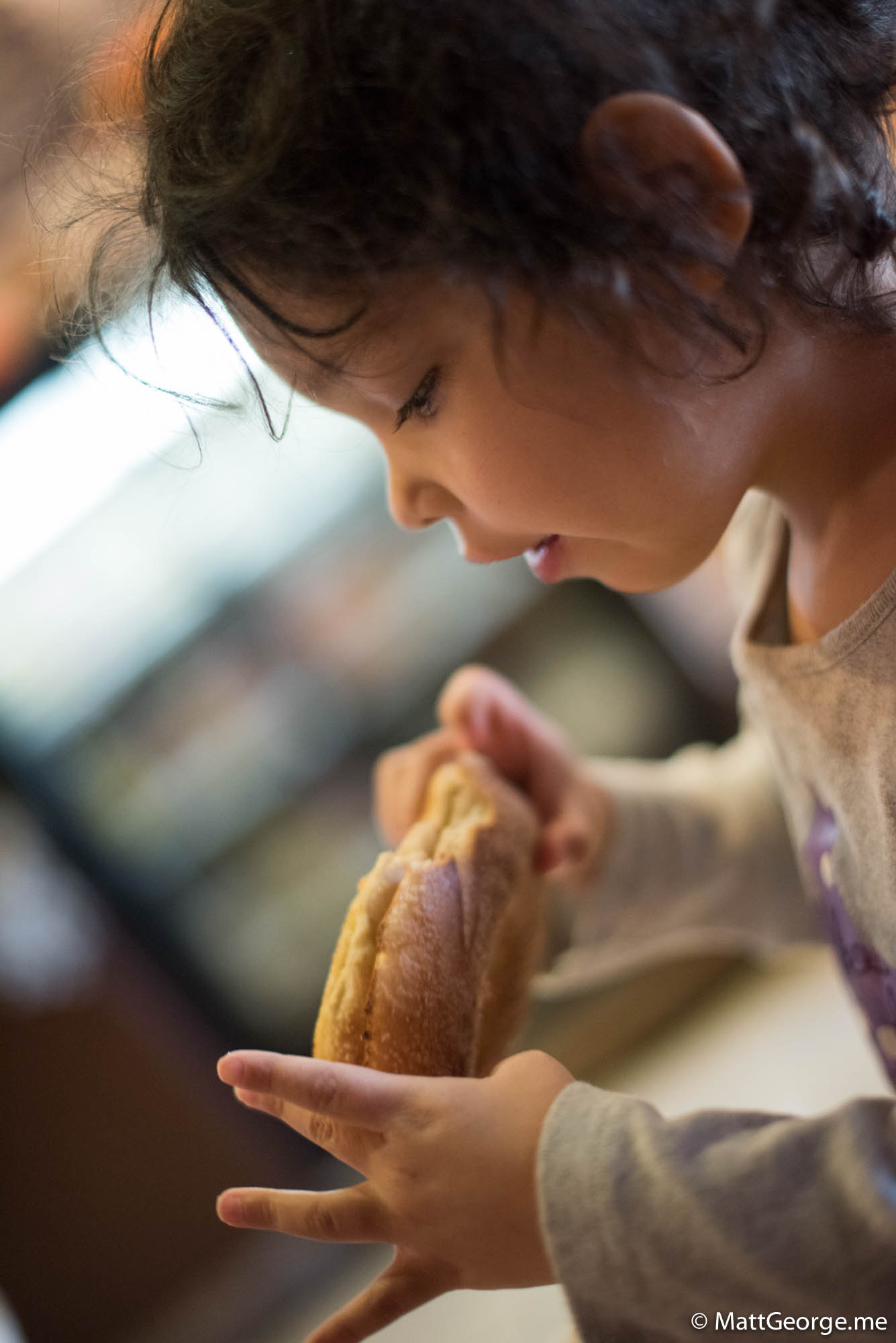 Bella eating her cinnamon bagel