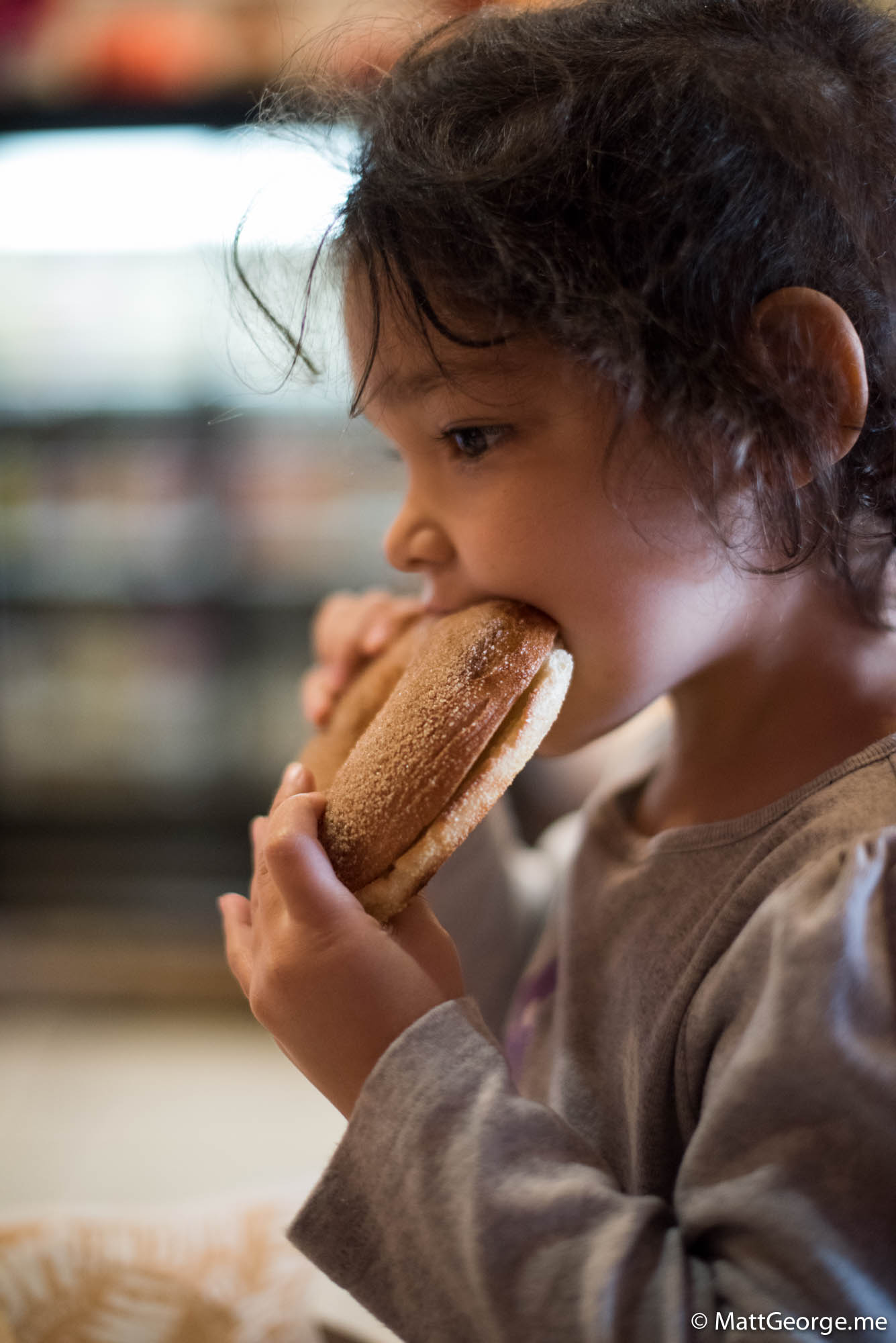 Bella eating her cinnamon bagel