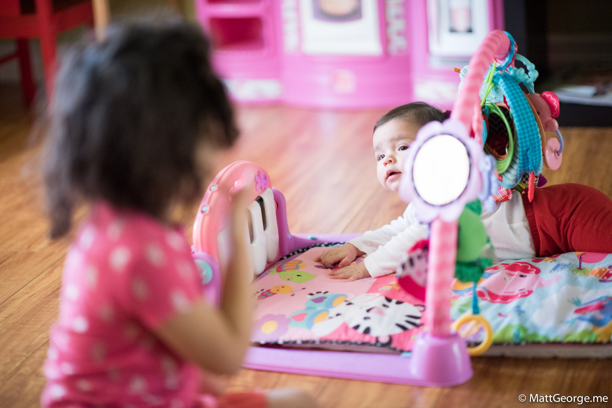 Baby Gianna Looking Over at her Big Sister