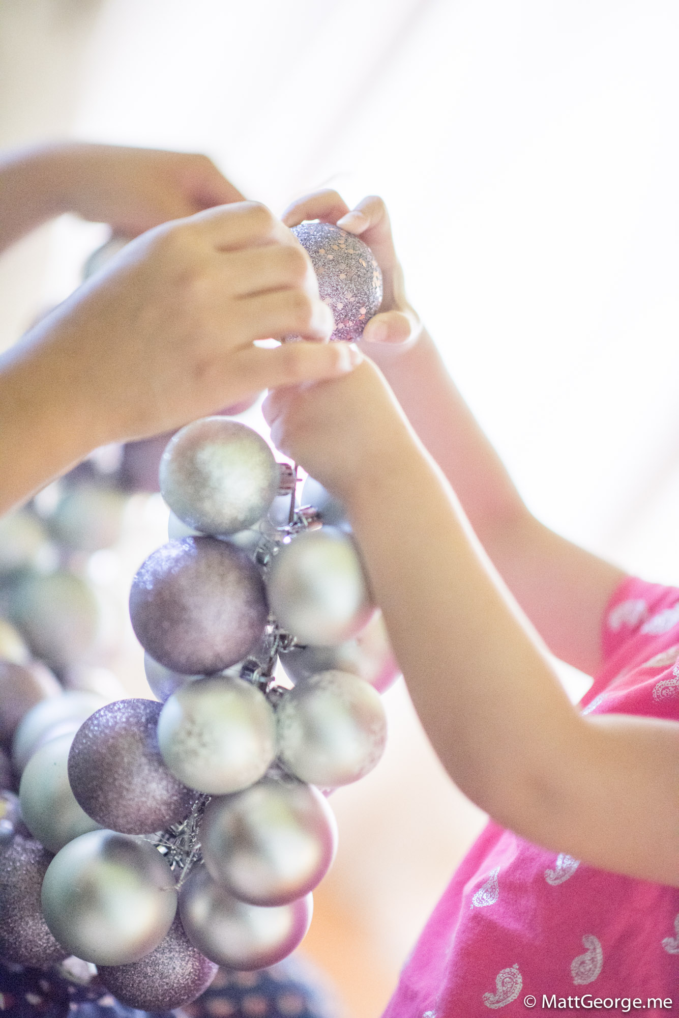 Bella and Mommy Working Together to Put the Christmas Wreath Together