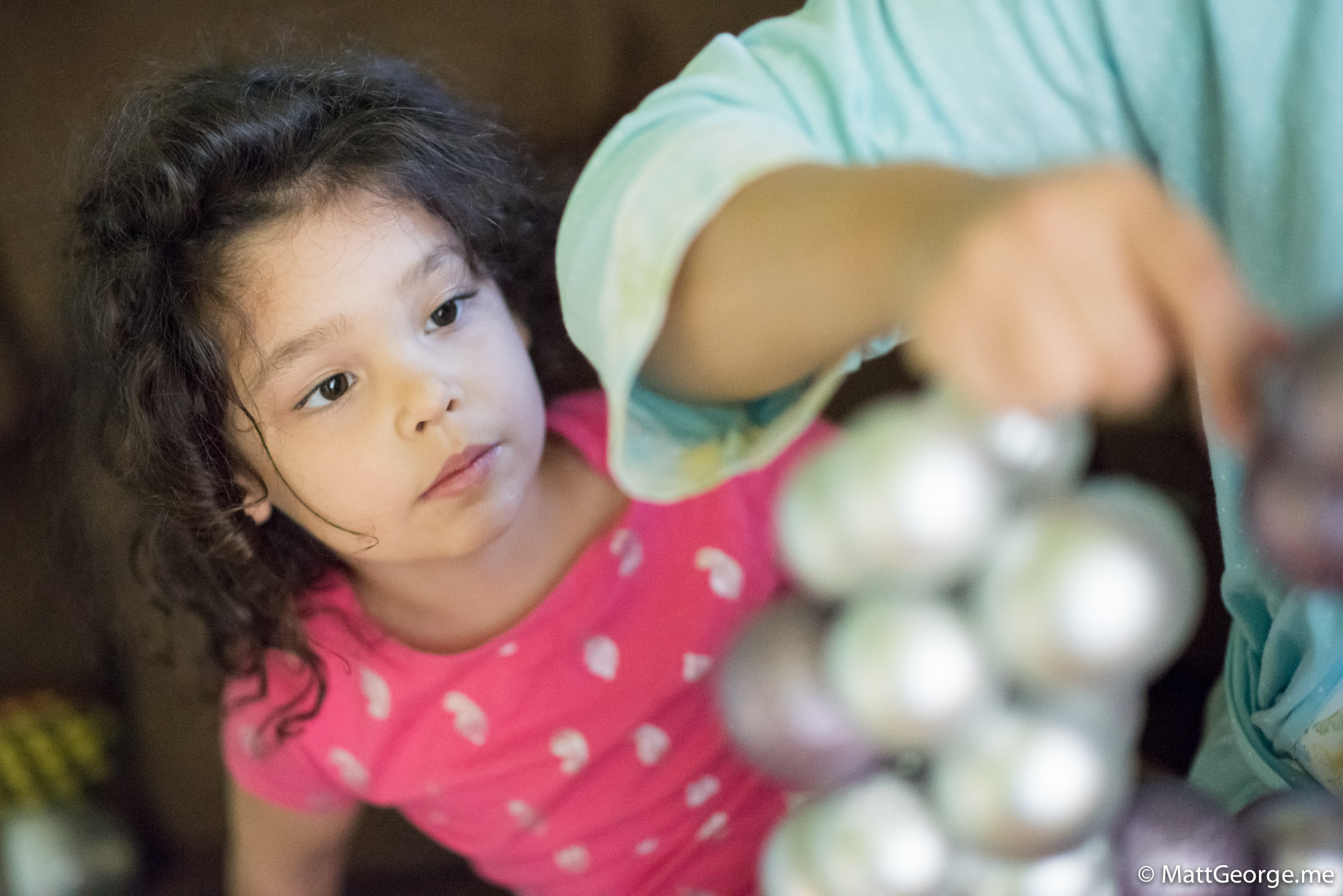 Bella Watching Mommy Put the Christmas Wreath Together