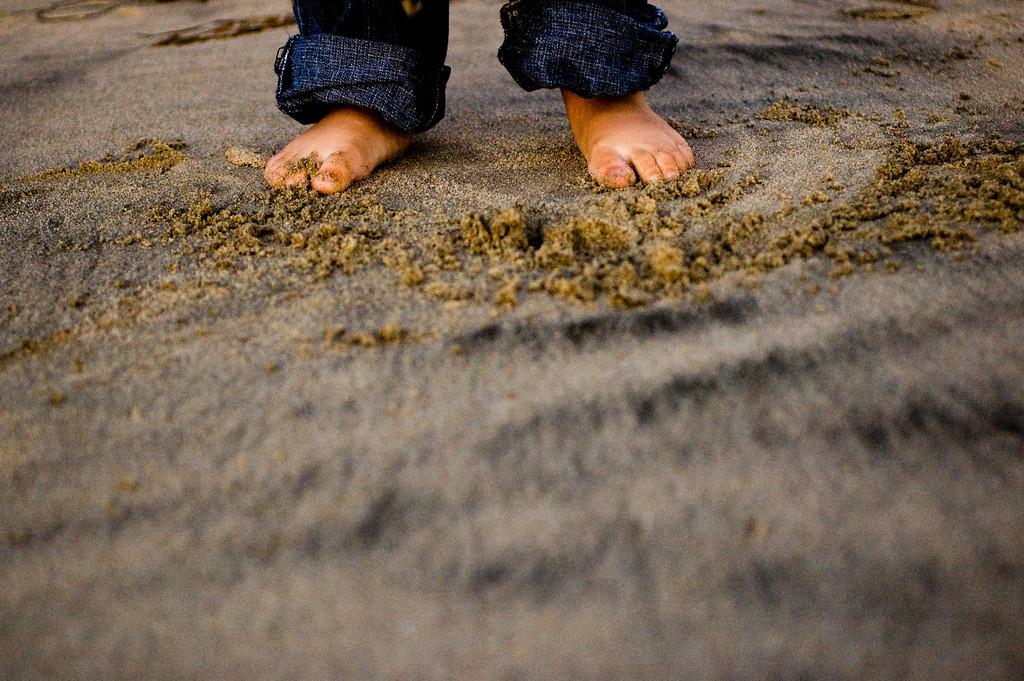 Close-up of Feet in Sand Portrait