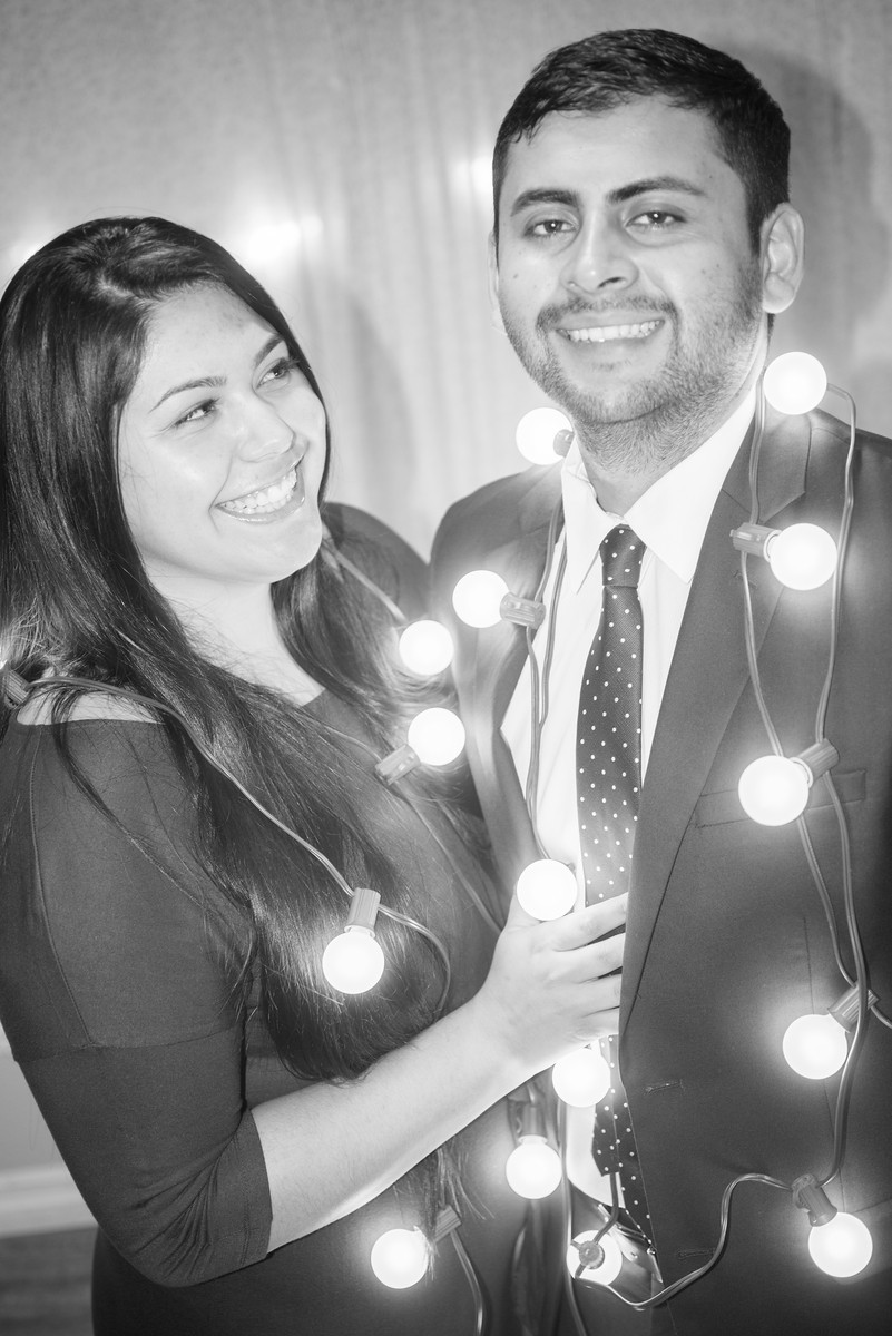 Christmas Lights Hanging on Couple Portrait