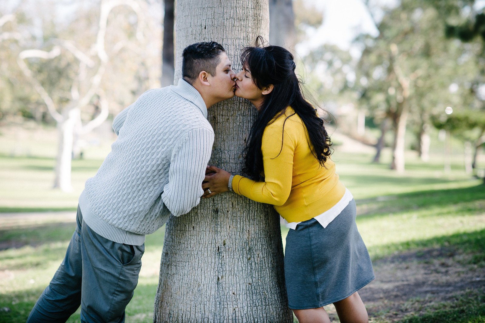 Couple Kissing in Front of Tree Portrait